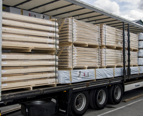 Log cabins, storage sheds, wooden doors & wooden windows ready for transport